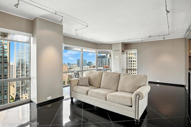 100 E Huron St Unit 2301, Chicago, IL 60611 - living room featuring a skyline view, rail lighting, plenty of natural light, and granite floors