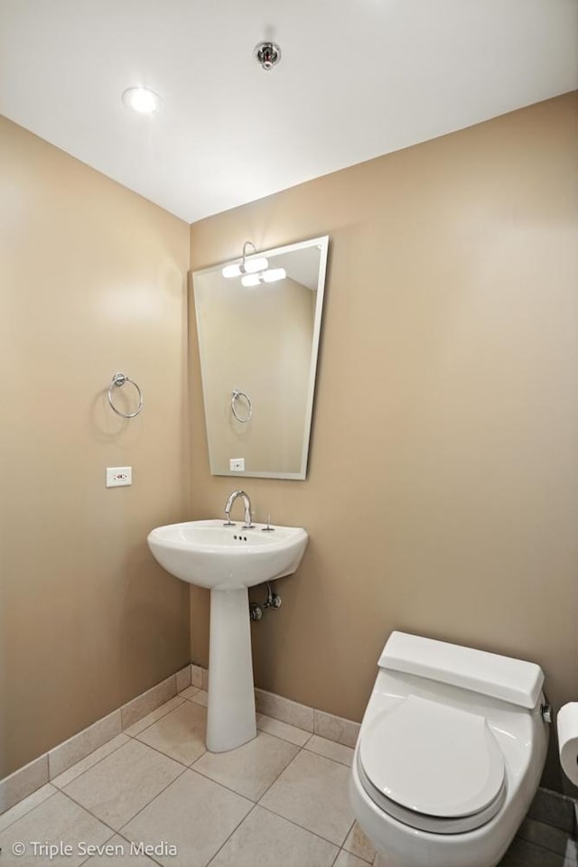100 E Huron St Unit 2301, Chicago, IL 60611 - half bath with toilet and tile patterned floors