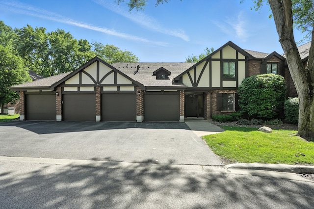 11315 Sycamore Ln Unit B, Palos Hills, IL 60465 - tudor home featuring brick siding, a garage, and driveway