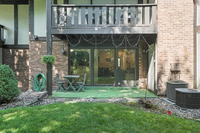 11315 Sycamore Ln Unit B, Palos Hills, IL 60465 - property entrance with a balcony, brick siding, and stucco siding