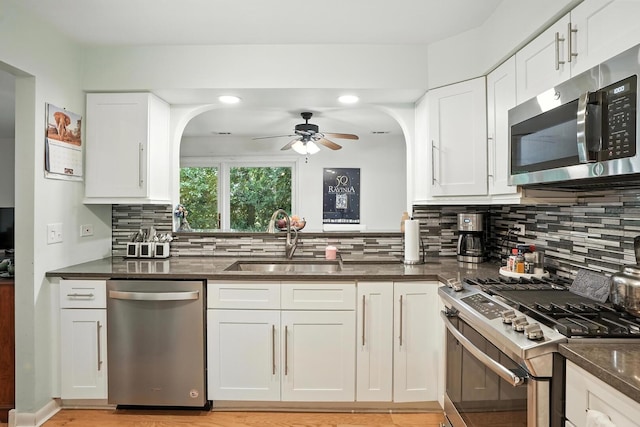 11315 Sycamore Ln Unit B, Palos Hills, IL 60465 - kitchen featuring stainless steel appliances, ceiling fan, tasteful backsplash, white cabinets, and recessed lighting