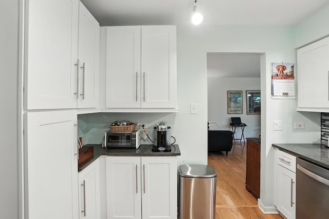 11315 Sycamore Ln Unit B, Palos Hills, IL 60465 - kitchen with stainless steel dishwasher, dark countertops, light wood-style floors, and white cabinets