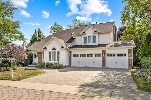 775 Harmon Blvd, Hoffman Estates, IL 60169 - view of front of house featuring decorative driveway, brick siding, and a garage