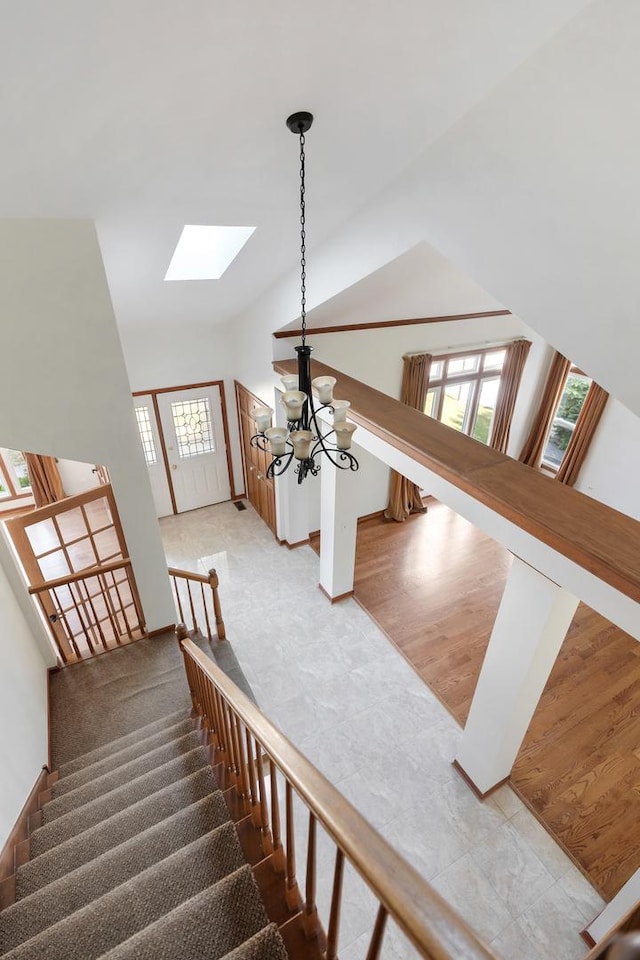 775 Harmon Blvd, Hoffman Estates, IL 60169 - stairs with a skylight, a chandelier, and vaulted ceiling