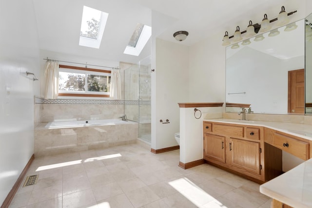 775 Harmon Blvd, Hoffman Estates, IL 60169 - bathroom with a skylight, a bath, vanity, a shower stall, and tile patterned floors