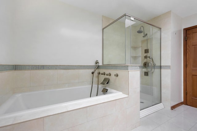 775 Harmon Blvd, Hoffman Estates, IL 60169 - bathroom featuring a stall shower, a bath, and tile patterned floors