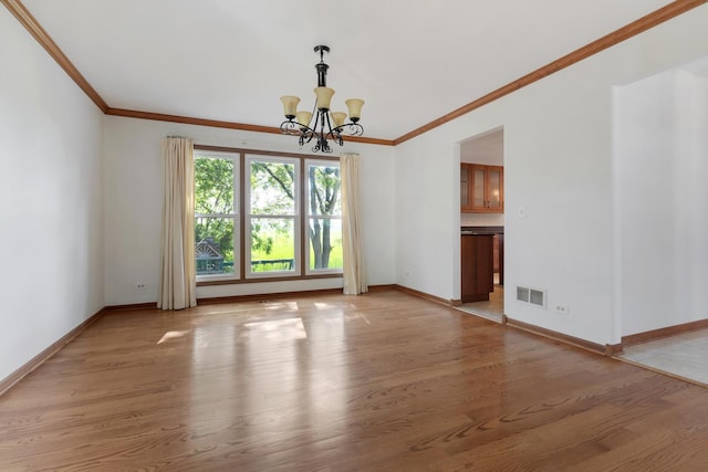 775 Harmon Blvd, Hoffman Estates, IL 60169 - unfurnished room with ornamental molding, a chandelier, and light wood finished floors