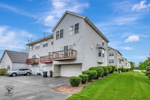 1372 Fox Hound Trl, Beecher, IL 60401 - back of property with an attached garage, a lawn, driveway, and a balcony