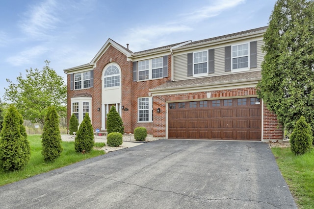 22600 W Reserve Cir, Plainfield, IL 60544 - view of front facade featuring asphalt driveway, an attached garage, and brick siding