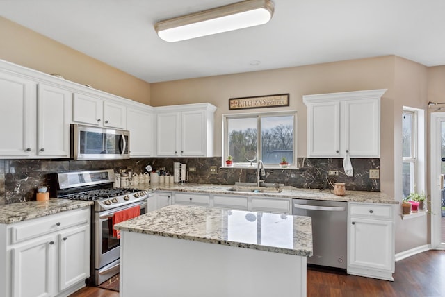 22600 W Reserve Cir, Plainfield, IL 60544 - kitchen featuring appliances with stainless steel finishes, white cabinets, and backsplash