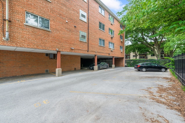 950 Washington Blvd Unit 206, Oak Park, IL 60302 - view of building exterior featuring covered and uncovered parking