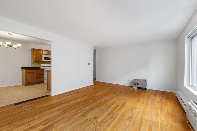 950 Washington Blvd Unit 206, Oak Park, IL 60302 - unfurnished living room with baseboard heating, a chandelier, and light wood-type flooring