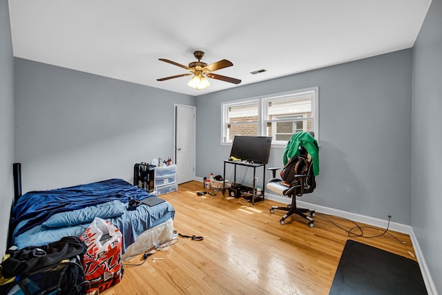 5567 W Gladys Ave, Chicago, IL 60644 - bedroom featuring wood finished floors and ceiling fan