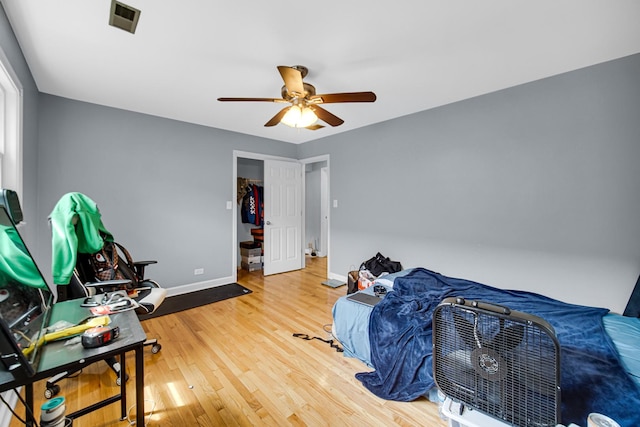 5567 W Gladys Ave, Chicago, IL 60644 - bedroom with wood finished floors and a ceiling fan