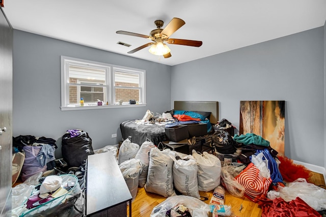 5567 W Gladys Ave, Chicago, IL 60644 - bedroom featuring wood finished floors and a ceiling fan