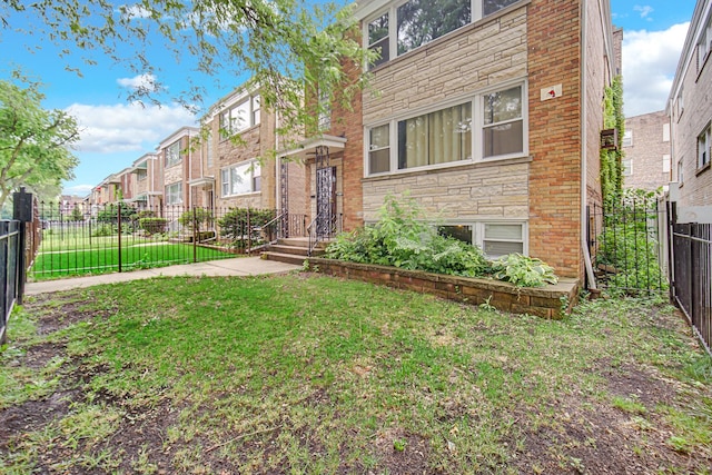 5567 W Gladys Ave, Chicago, IL 60644 - view of front of home with a residential view and brick siding