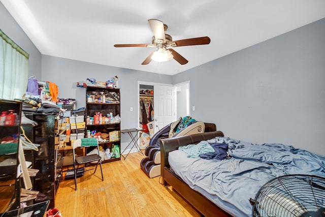5567 W Gladys Ave, Chicago, IL 60644 - bedroom with wood finished floors, ceiling fan, and a closet
