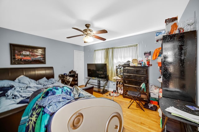 5567 W Gladys Ave, Chicago, IL 60644 - bedroom with wood finished floors and a ceiling fan