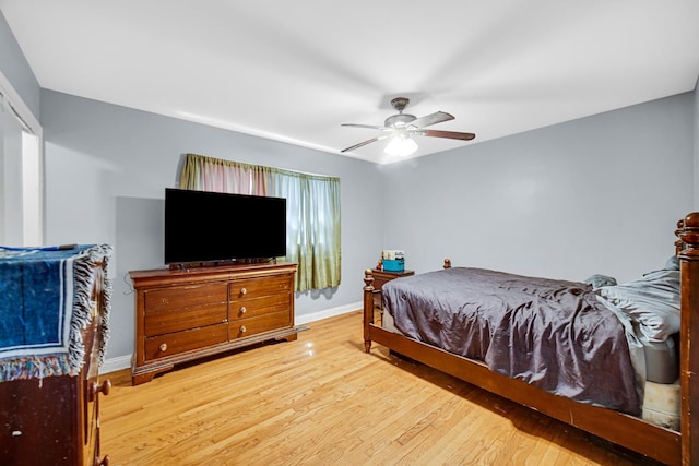 5567 W Gladys Ave, Chicago, IL 60644 - bedroom with wood-type flooring and ceiling fan