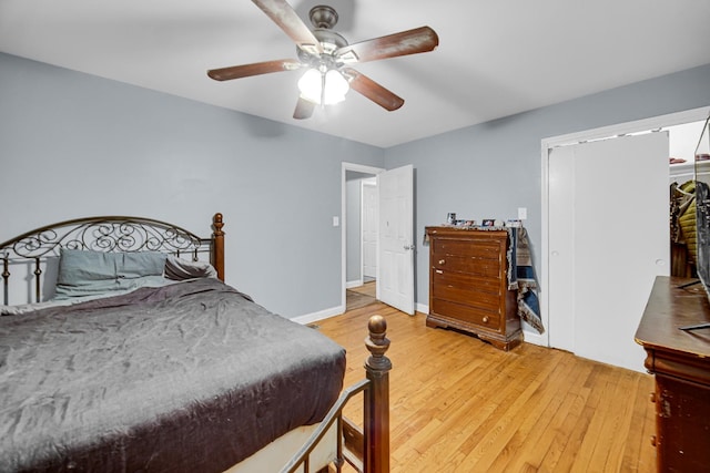 5567 W Gladys Ave, Chicago, IL 60644 - bedroom with light wood finished floors and ceiling fan