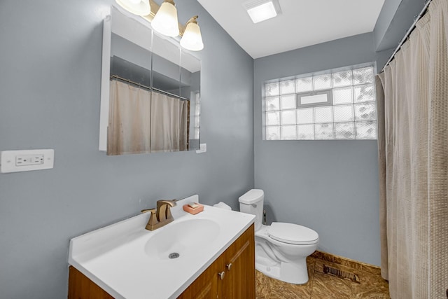 5567 W Gladys Ave, Chicago, IL 60644 - full bathroom featuring vanity and toilet