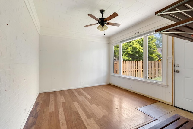 323 S Prindle Ave, Arlington Heights, IL 60004 - unfurnished room with wood finished floors, ceiling fan, ornamental molding, and brick wall