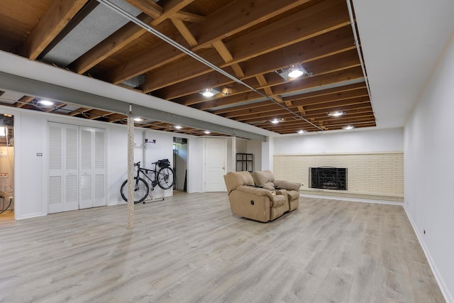 323 S Prindle Ave, Arlington Heights, IL 60004 - living area featuring a brick fireplace, wood finished floors, and gas water heater