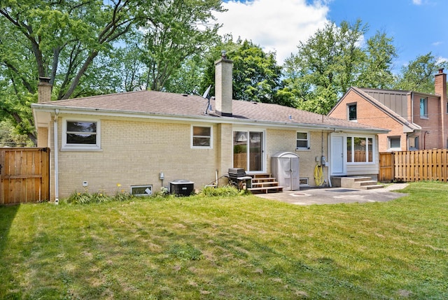 323 S Prindle Ave, Arlington Heights, IL 60004 - rear view of house with entry steps, a chimney, and brick siding