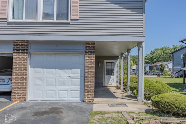 21 Elm Ct Unit 3, Bolingbrook, IL 60440 - entrance to property with brick siding and a garage