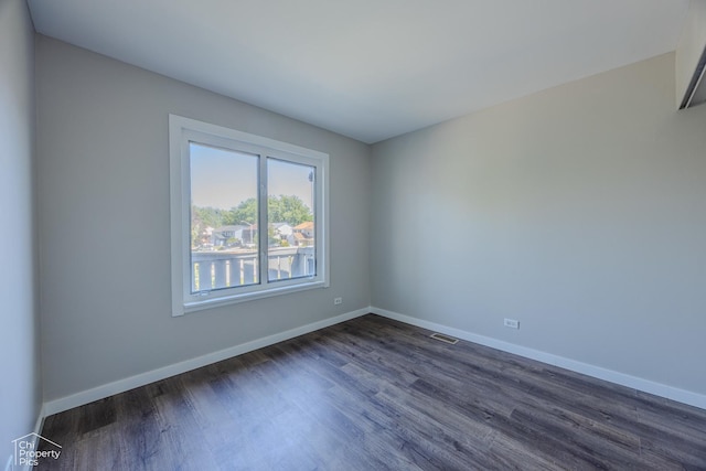 21 Elm Ct Unit 3, Bolingbrook, IL 60440 - spare room featuring dark wood-style flooring