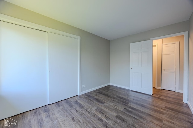 21 Elm Ct Unit 3, Bolingbrook, IL 60440 - unfurnished bedroom featuring wood finished floors and a closet