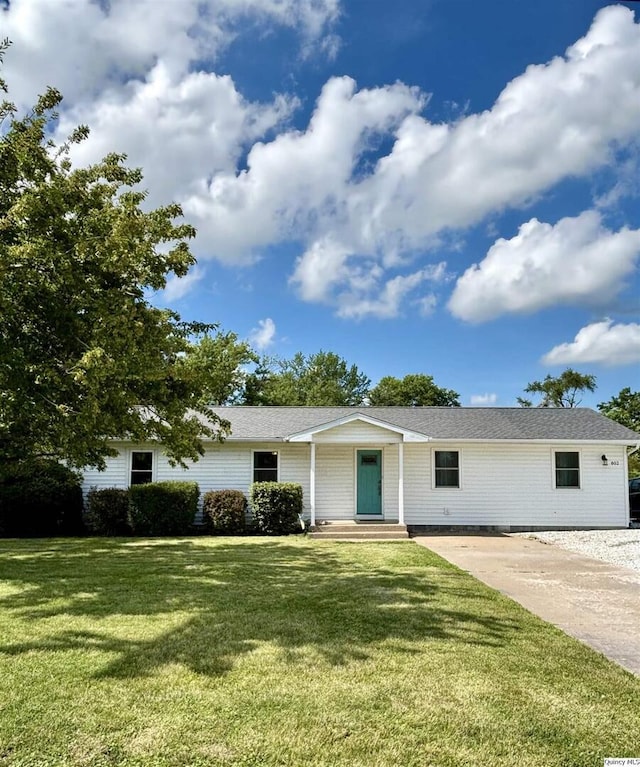 802 W Main St, La Harpe, IL 61450 - view of front facade featuring a front yard and driveway