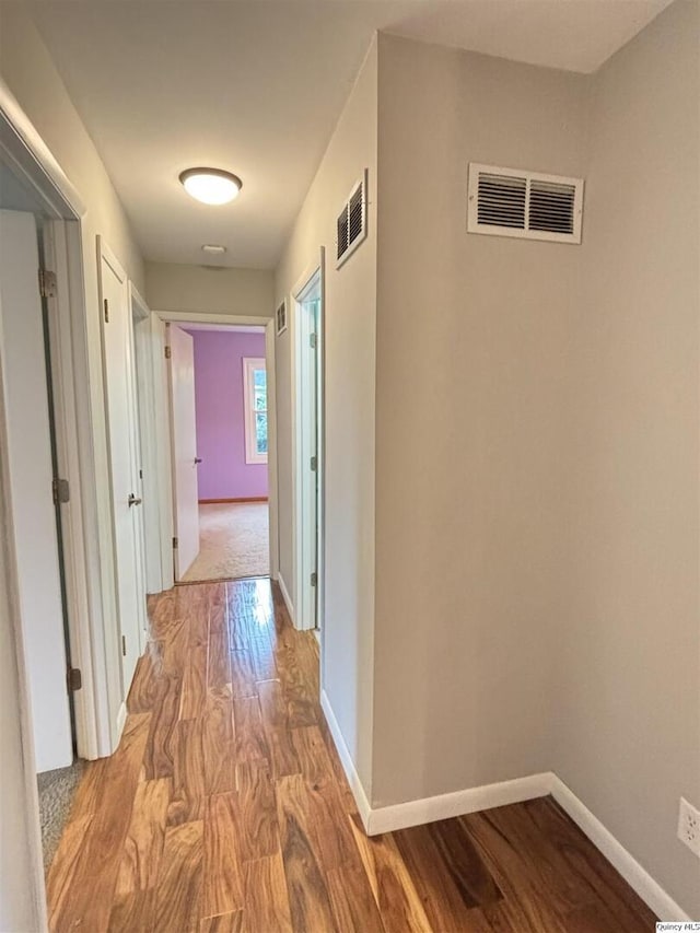 802 W Main St, La Harpe, IL 61450 - hall with baseboards and wood finished floors