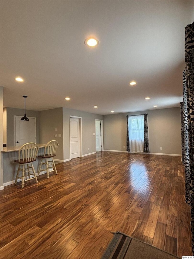 802 W Main St, La Harpe, IL 61450 - living area with wood finished floors and recessed lighting