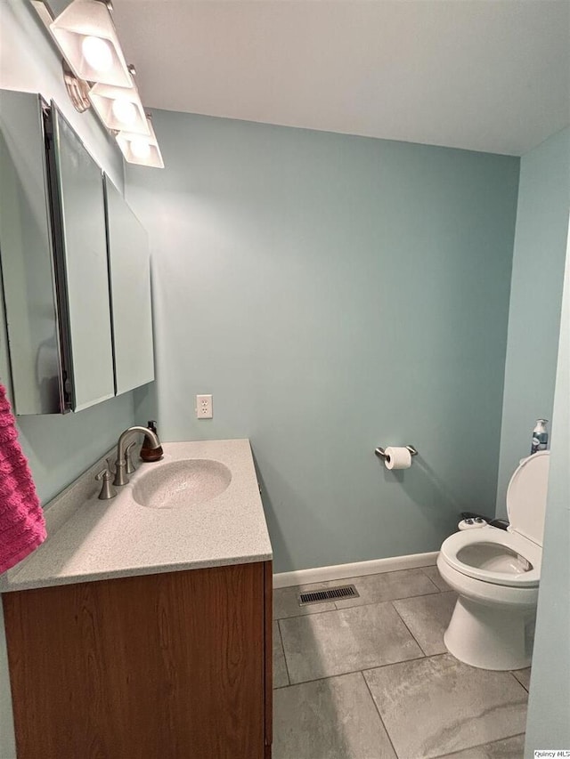 802 W Main St, La Harpe, IL 61450 - half bath with vanity and tile patterned flooring