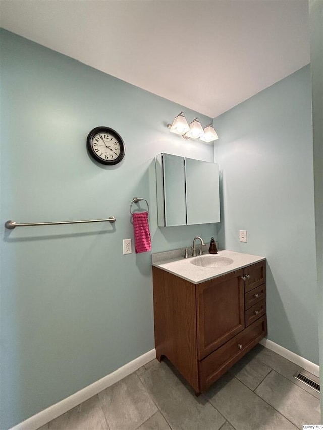 802 W Main St, La Harpe, IL 61450 - bathroom featuring vanity and baseboards