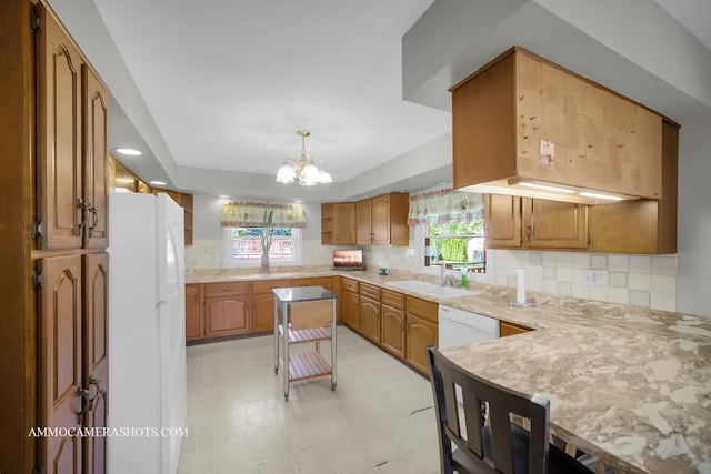 506 S 5th St, Malta, IL 60150 - kitchen with white appliances, a chandelier, light countertops, and recessed lighting