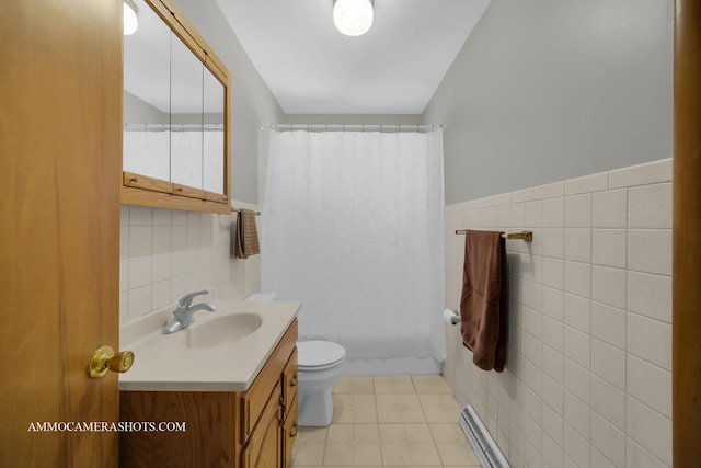 506 S 5th St, Malta, IL 60150 - full bathroom with tile walls, vanity, shower / tub combo, and wainscoting