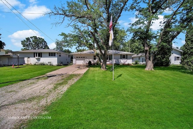506 S 5th St, Malta, IL 60150 - ranch-style house with concrete driveway, an attached garage, and a front yard