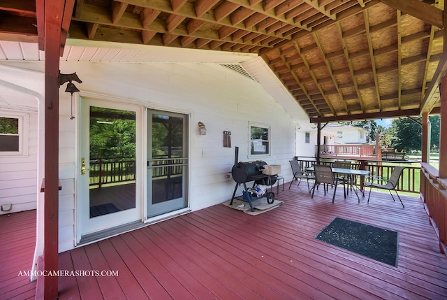 506 S 5th St, Malta, IL 60150 - wooden terrace with outdoor dining area and a grill