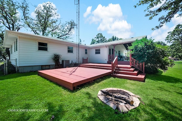 506 S 5th St, Malta, IL 60150 - rear view of house featuring a fire pit and a deck