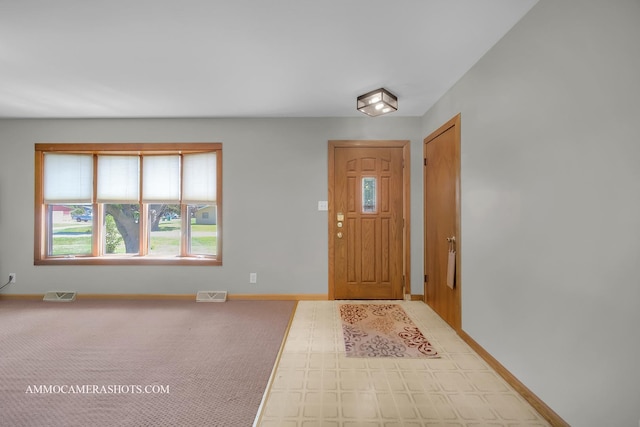 506 S 5th St, Malta, IL 60150 - foyer with healthy amount of natural light and tile patterned floors