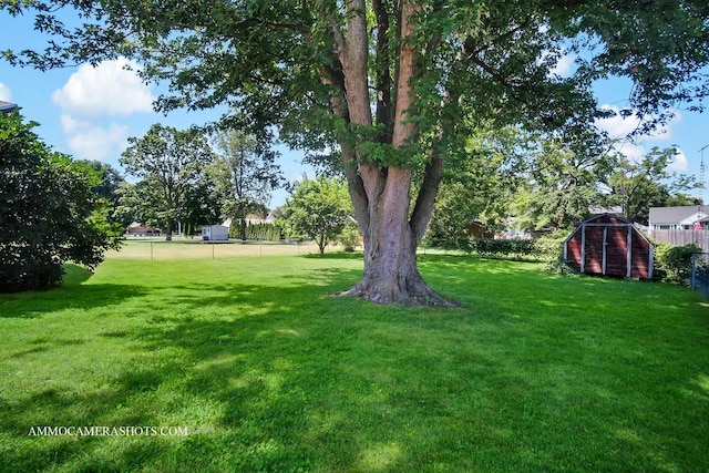 506 S 5th St, Malta, IL 60150 - fenced backyard with a storage shed