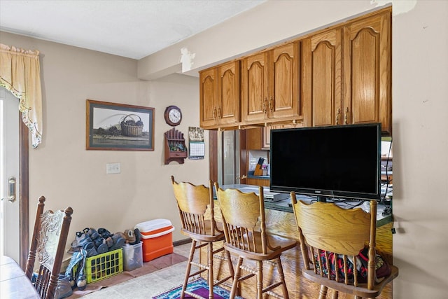519 S 4th St, Fairbury, IL 61739 - kitchen with brown cabinets and light tile patterned floors