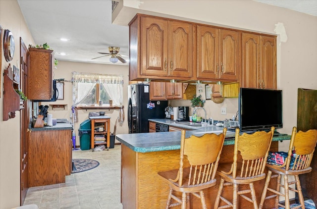 519 S 4th St, Fairbury, IL 61739 - kitchen with freestanding refrigerator, brown cabinets, a ceiling fan, and recessed lighting