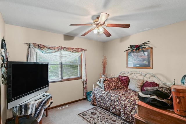 519 S 4th St, Fairbury, IL 61739 - carpeted bedroom featuring baseboards and a ceiling fan