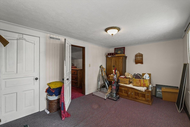 519 S 4th St, Fairbury, IL 61739 - carpeted bedroom featuring a textured ceiling and ornamental molding