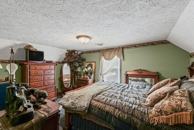 519 S 4th St, Fairbury, IL 61739 - bedroom with a textured ceiling, carpet, and vaulted ceiling