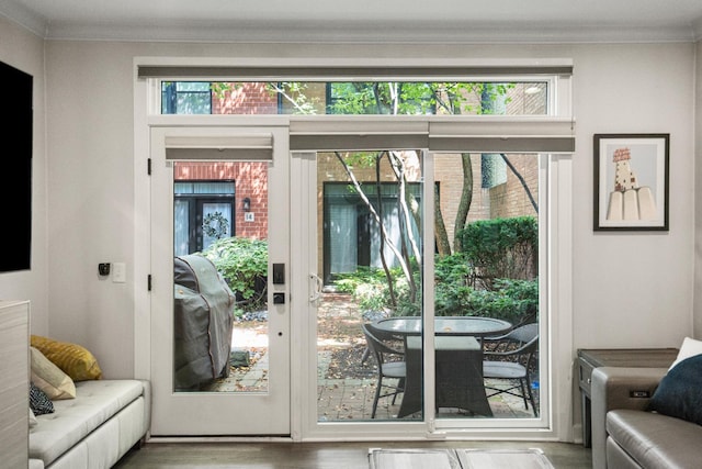1801 W Diversey Pkwy Unit 36, Chicago, IL 60614 - doorway to outside featuring crown molding and wood finished floors