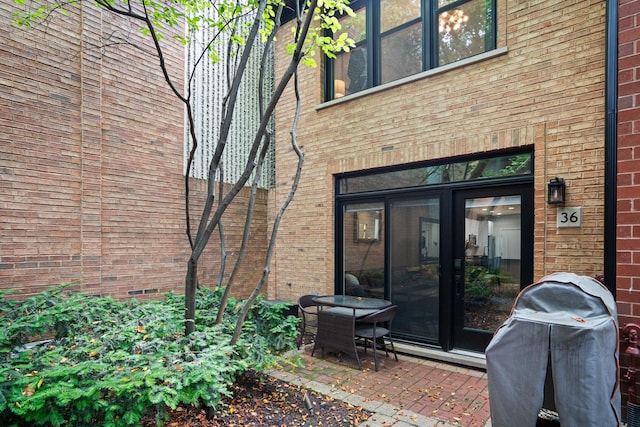1801 W Diversey Pkwy Unit 36, Chicago, IL 60614 - back of property featuring brick siding and a patio